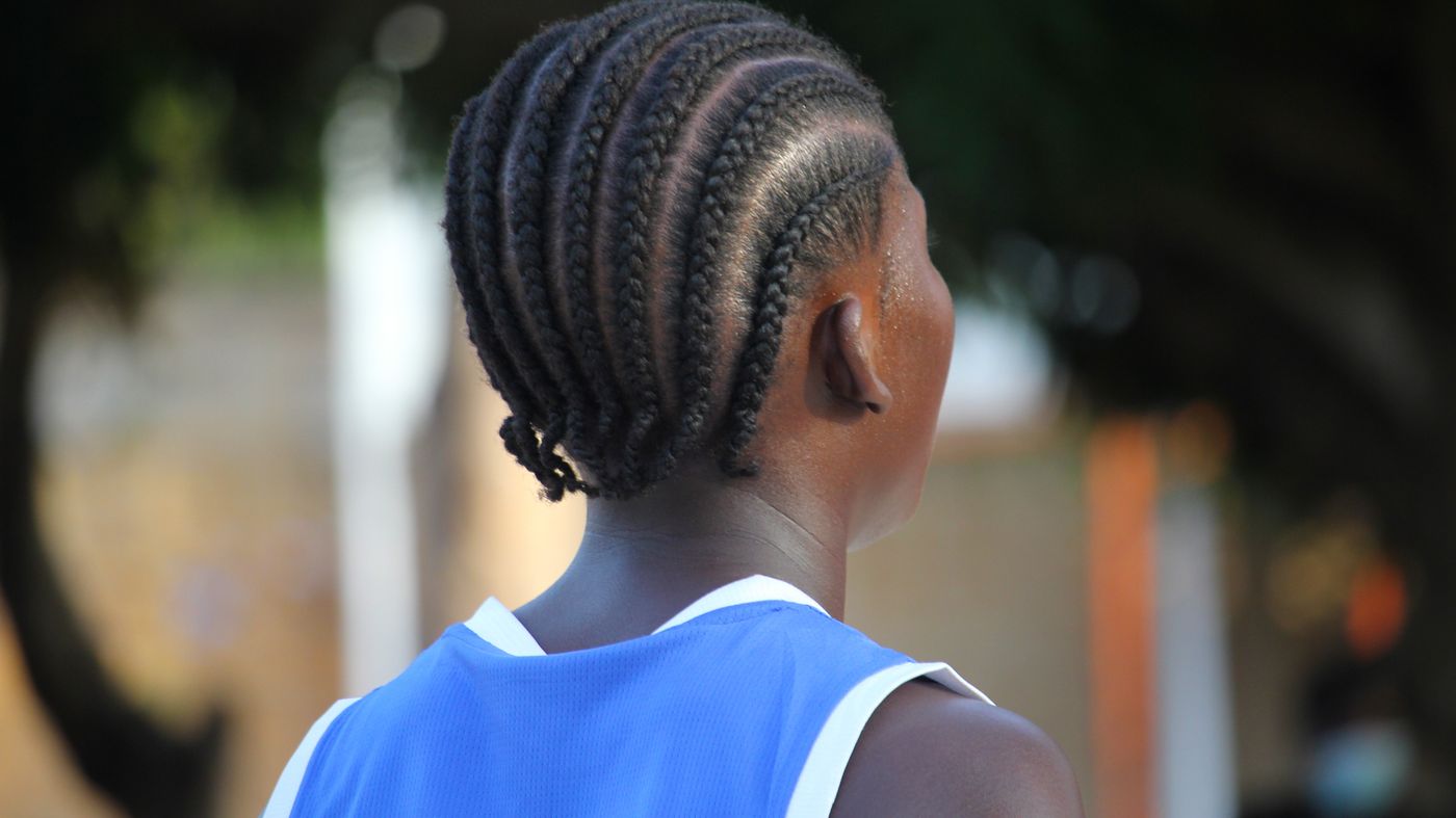Back view of tightly braided cornrows, the kind of tight hairstyles linked with traction alopecia