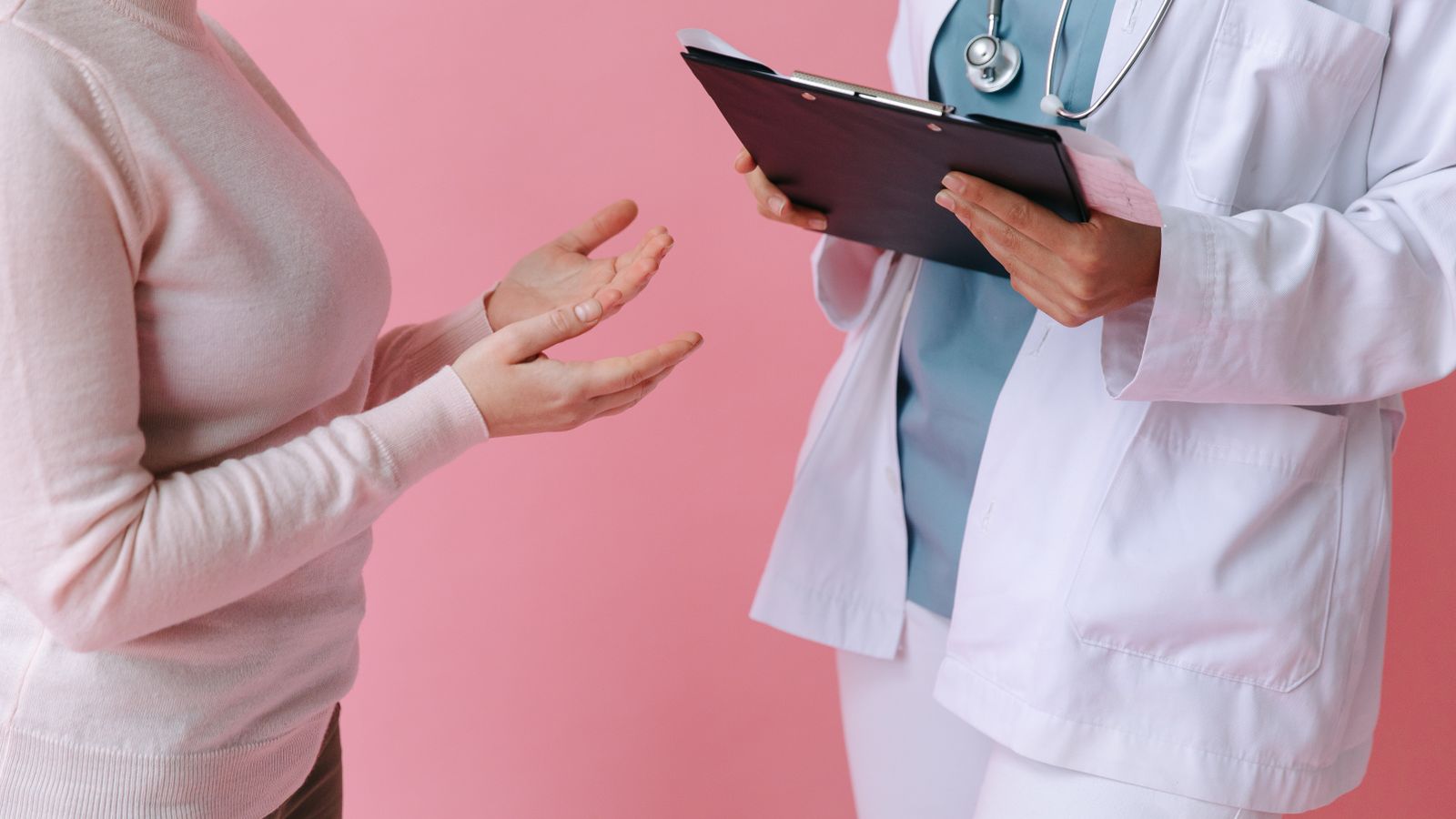 Patient consulting a hair and scalp specialist with a clipboard, similar to a trichologist appointment in Bexley