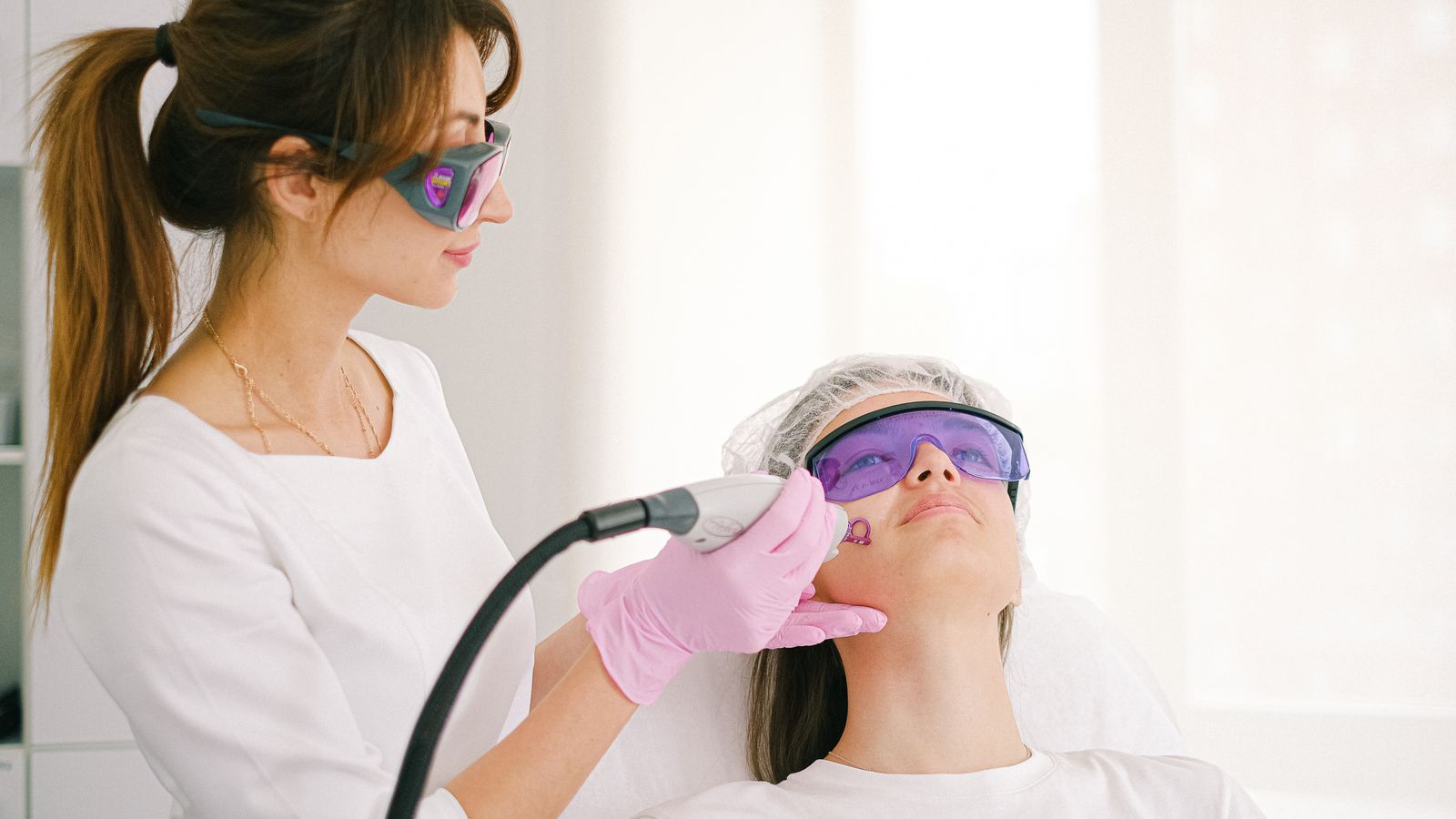Trichologist in Colchester examining a patient's scalp and hair