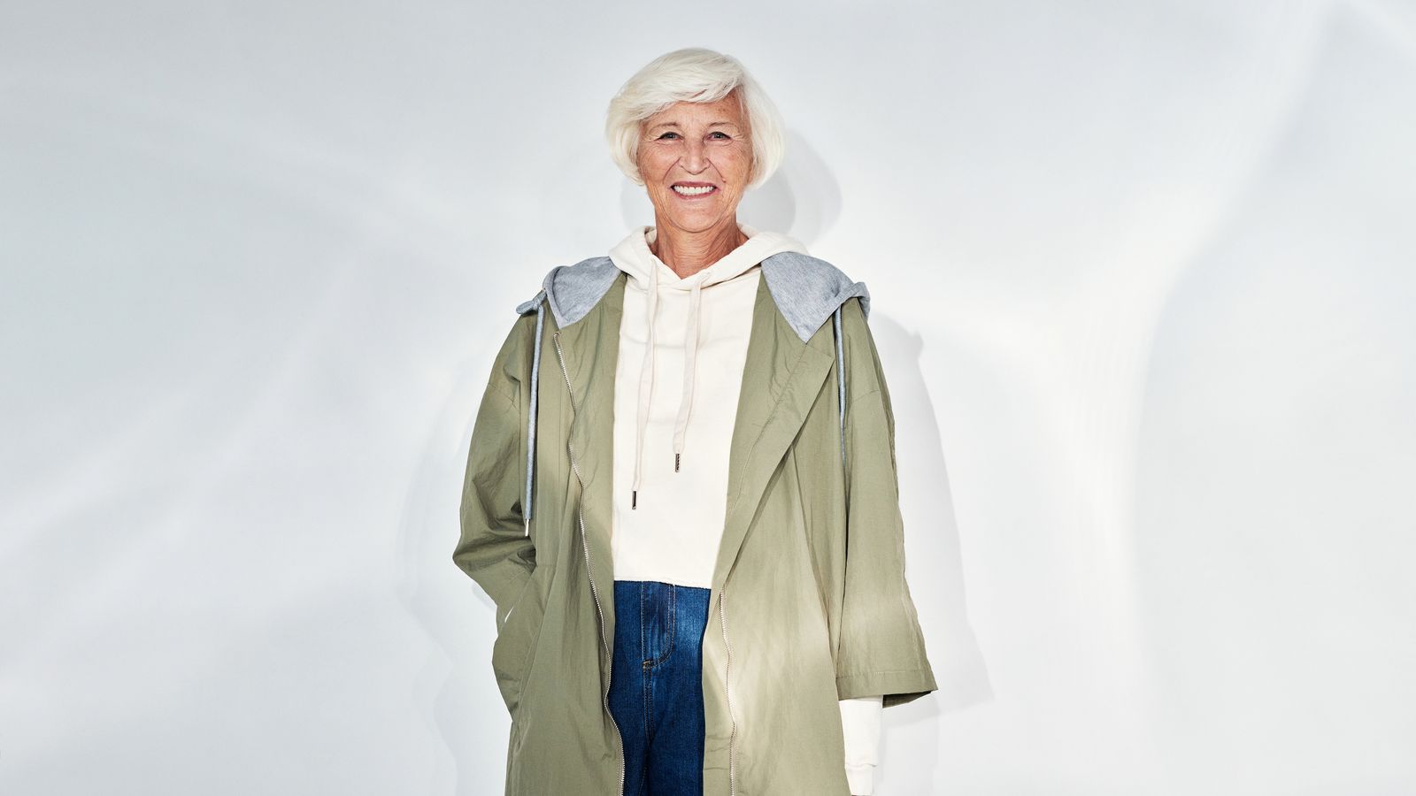 Smiling senior woman with white hair, the hair after 50 changes a trichologist in Havering assesses