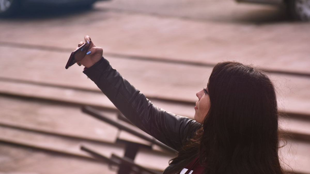 Taking a selfie outdoors, the kind of photo that prompts people to search for trichologists Chesterfield