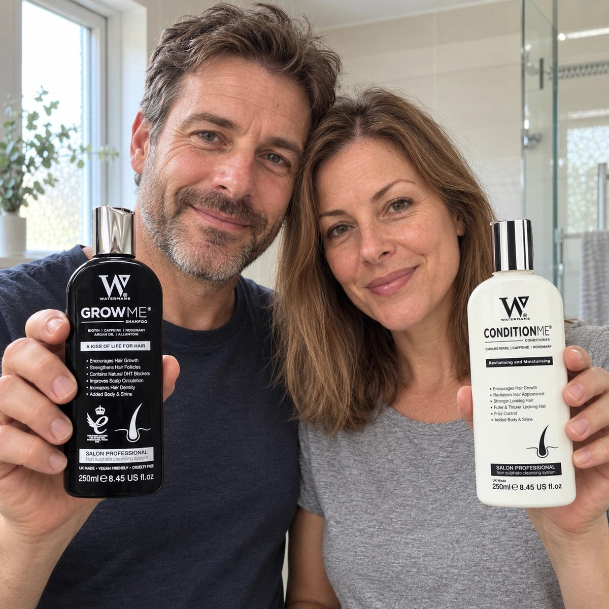 Best hair growth products: a man and a woman holding Watermans Grow Me shampoo and Condition Me conditioner