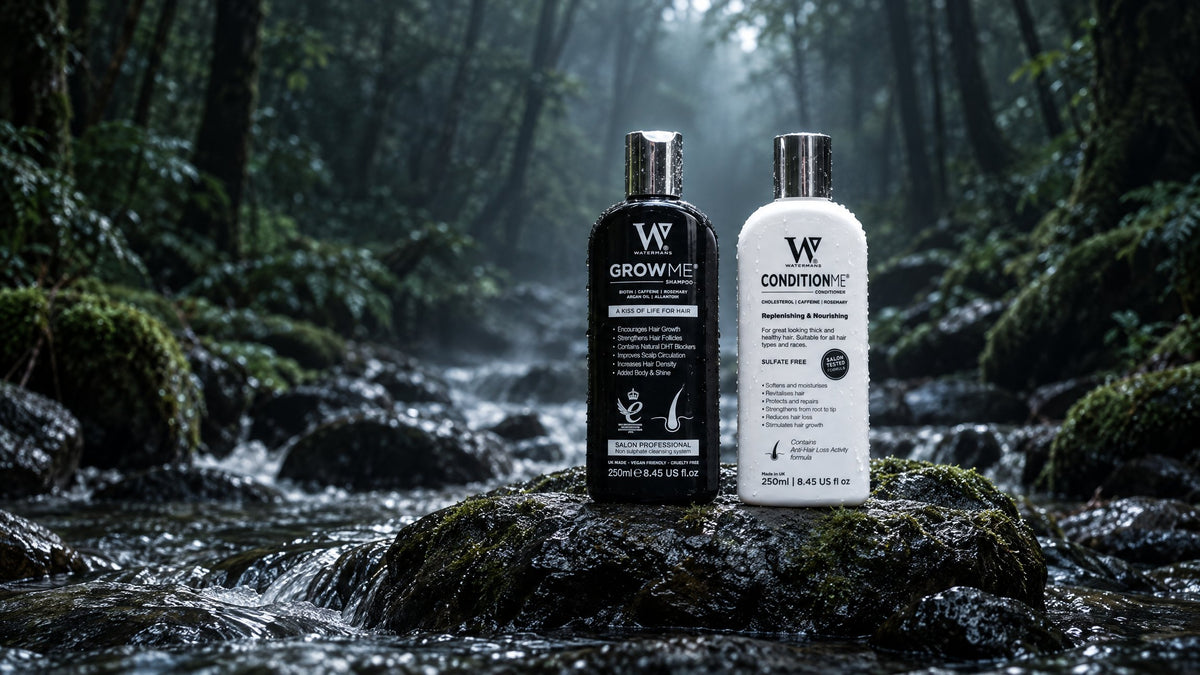 Watermans Grow Me hair growth shampoo and Condition Me conditioner set on a wet rock in a misty forest stream