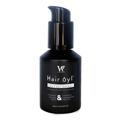 Camellia and black castor oil bottle used on a dry cropped scalp